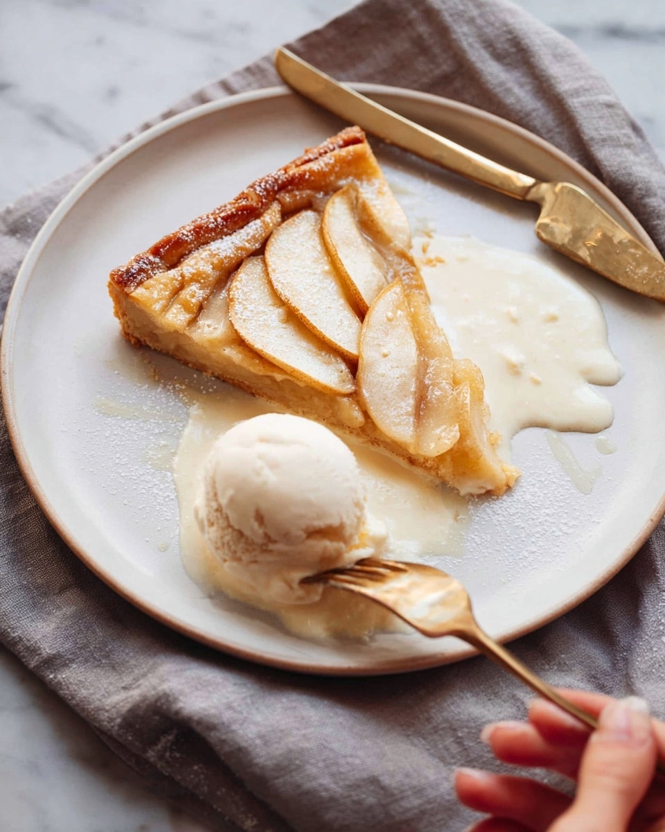 A white plate holds a slice of golden-brown apple tart with a flaky crust, topped with thin, cream-colored apple slices arranged in a fan shape. The tart is partially covered with melting white cream, pooling softly around it, and a scoop of smooth, light beige ice cream sits beside the tart. A gold and white knife rests near the top edge of the plate while a silver fork is held by a woman's hand, gently lifting a piece of the tart. The plate sits on a soft gray cloth over a white marbled surface. Photo taken with an iphone --ar 4:5 --v 7