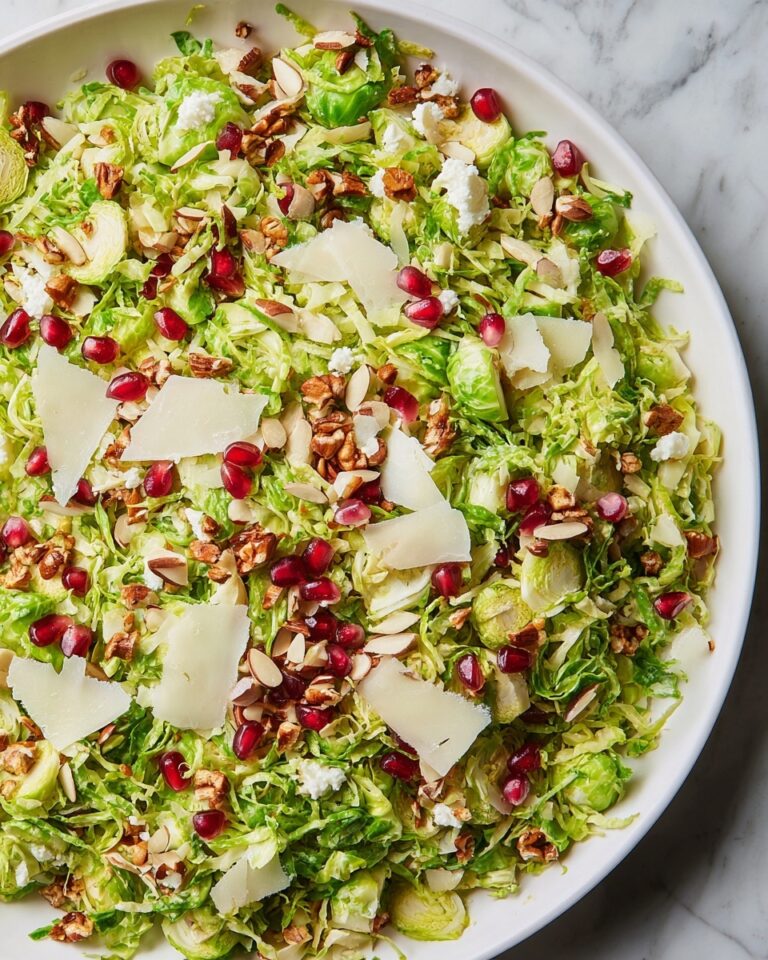 Brussels Sprout Salad with Lemon, Parsley, Almonds, and Pomegranate Seeds Recipe